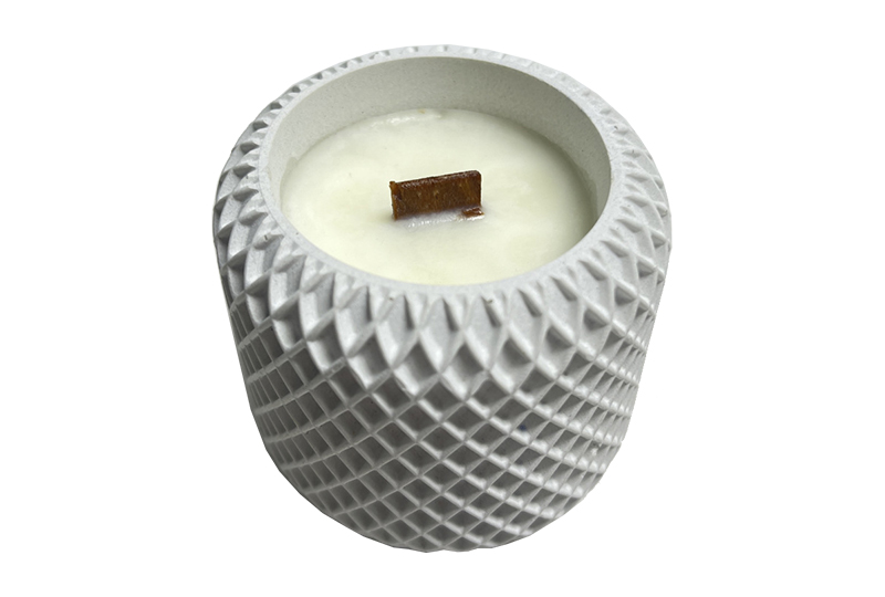 Bougie en pot de ciment texturé sculpté géométrique