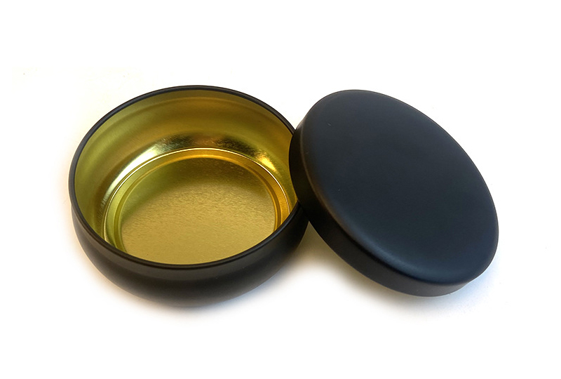 Pot rond en métal avec bougie noire avec couvercle